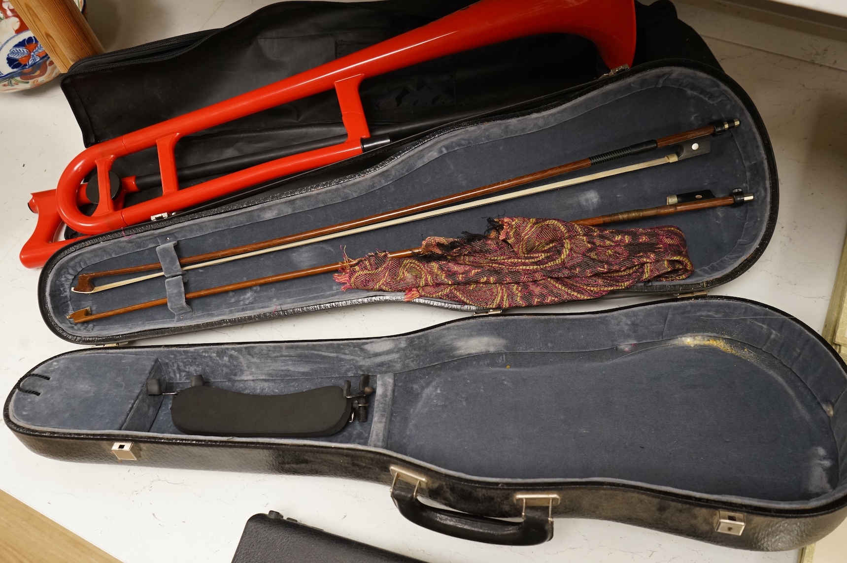 Three musical instruments to include a Buffet flute and violin with two bows